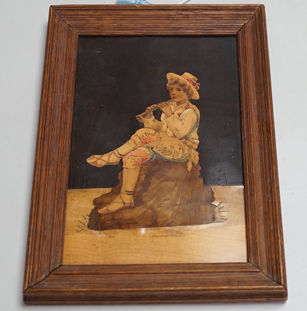 A Sorrentoware marquetry panel of a boy playing a flute, 14cm wide, 21.5cm high